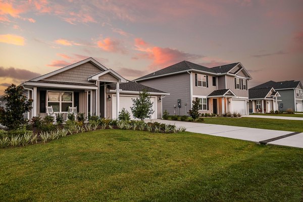 Sunset Village Apartments: Scenic garden pathways at luxury residence in a prime location