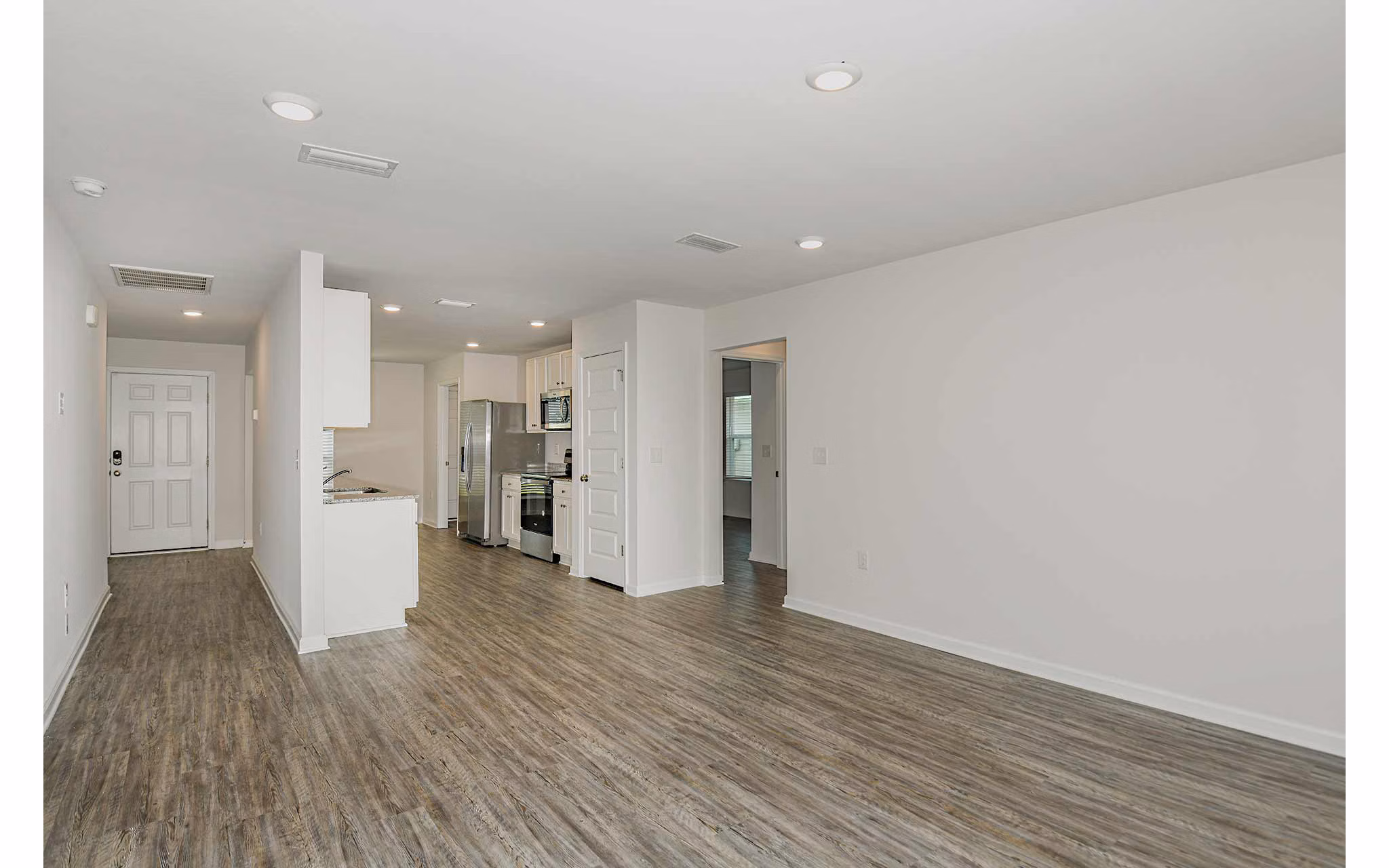 Spacious kitchen with modern appliances in Sunset Village Apartments