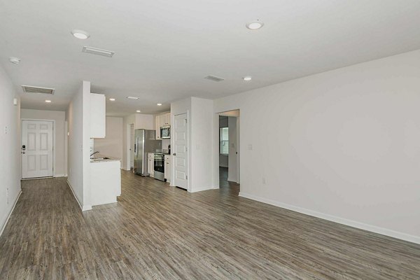 Spacious kitchen with modern appliances in Sunset Village Apartments