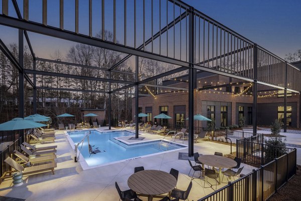 Courtyard at Broadstone Peachtree Corners Apartments featuring lush gardens and outdoor seating
