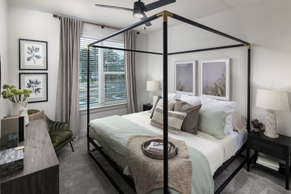 Cozy bedroom featuring modern decor and plush bedding at Elan Brookwood Apartments