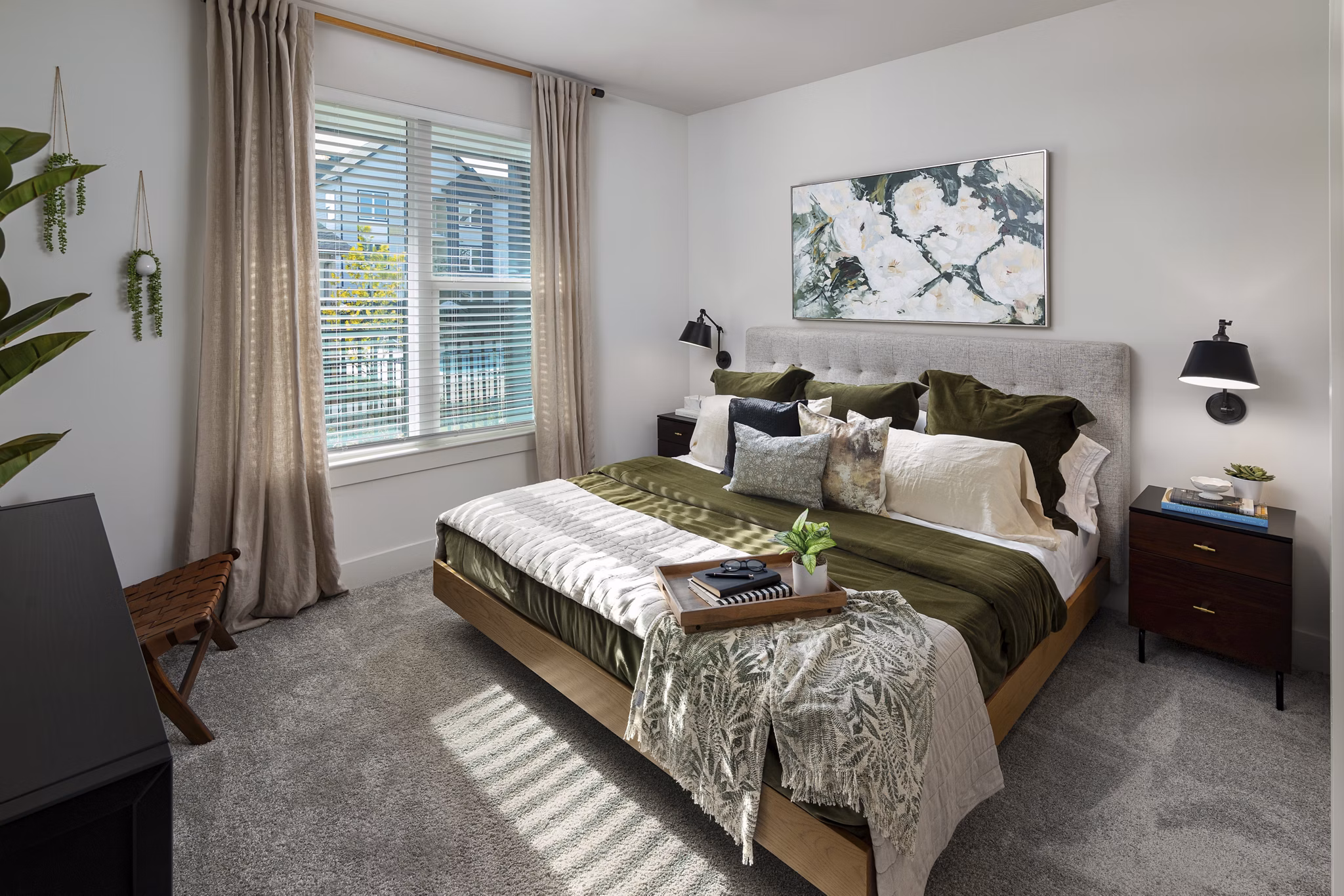 Modern bedroom with elegant decor including a plush bed and stylish lighting at Elan Brookwood Apartments, luxury living in the heart of the city