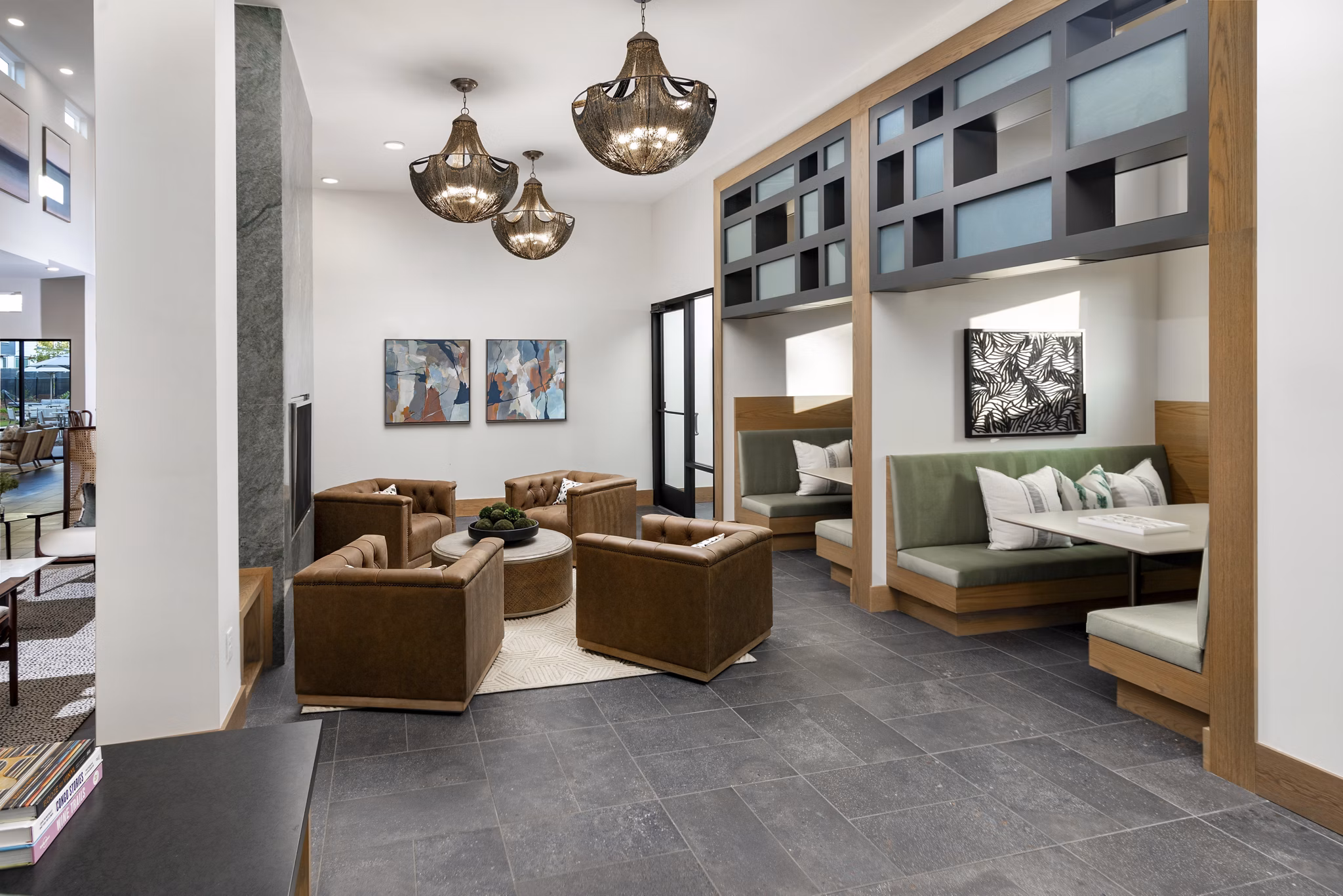 Modern clubhouse featuring chic seating and game tables at Elan Brookwood Apartments