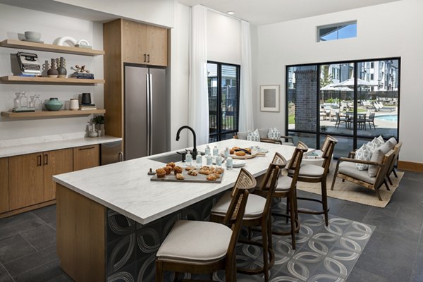 Elegant clubhouse featuring modern decor and ample seating at Elan Brookwood Apartments