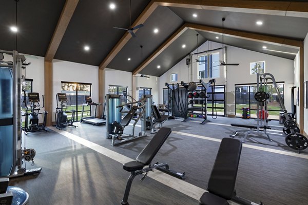 Modern fitness center with state-of-the-art equipment at Elan Brookwood Apartments