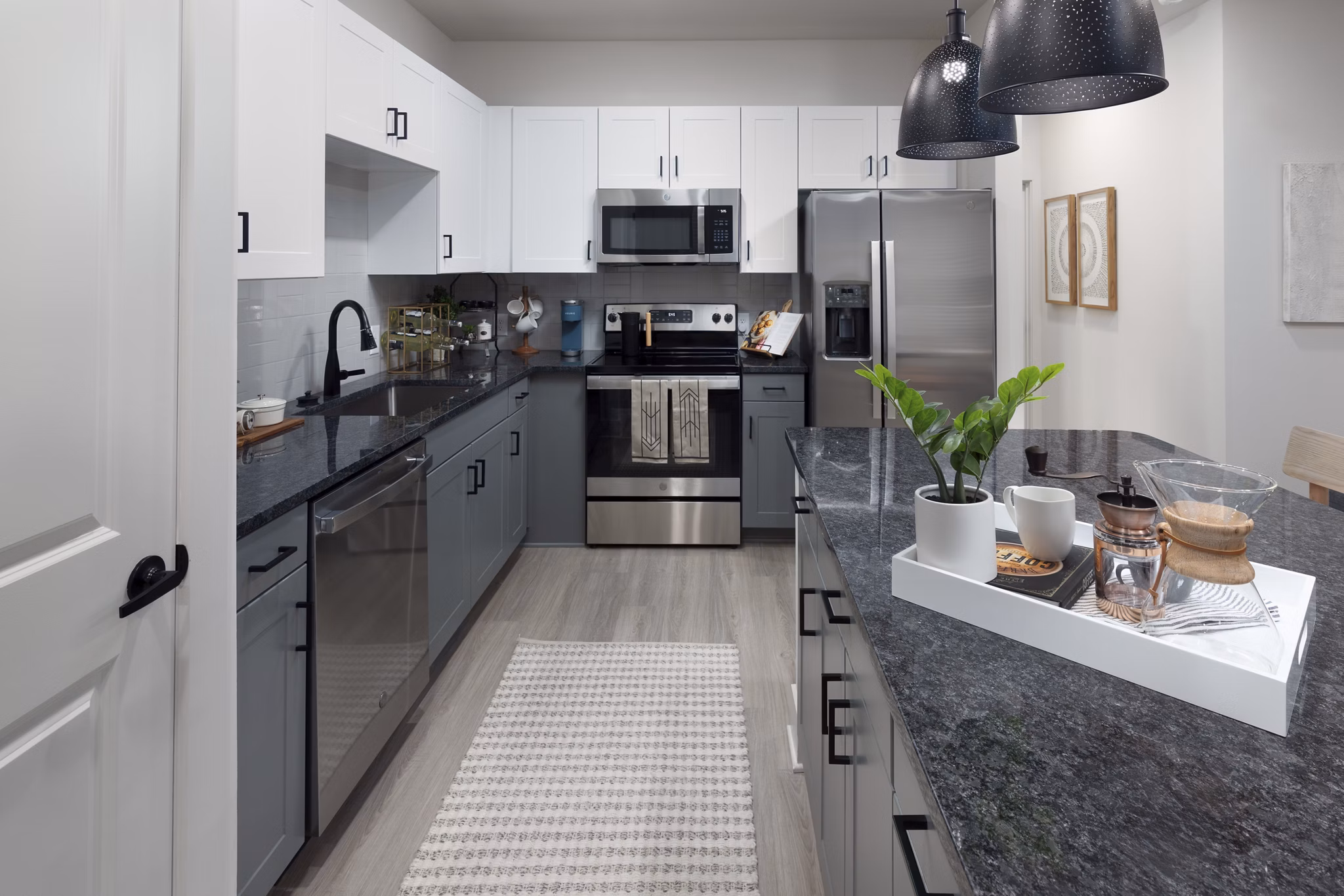 Modern kitchen with sleek cabinetry and stainless steel appliances at Elan Brookwood Apartments