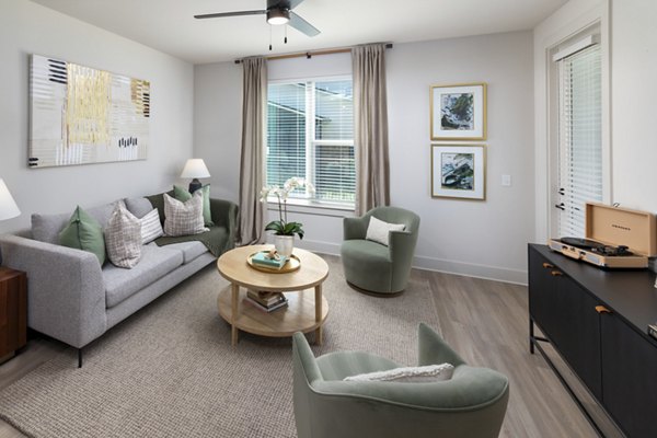 Spacious living room with modern decor at Elan Brookwood Apartments
