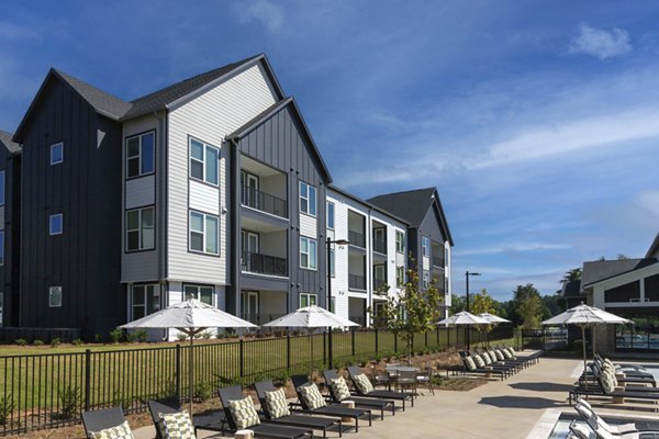 Relaxing patio with stylish seating at Elan Brookwood Apartments in a serene setting