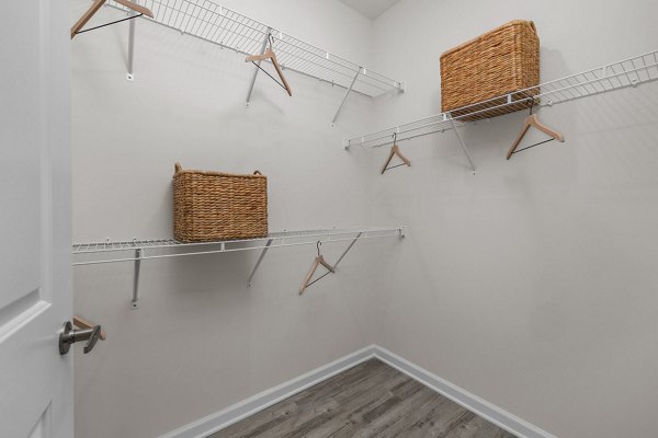 Spacious closet with custom shelving in a bedroom at Coastal Exchange Apartments