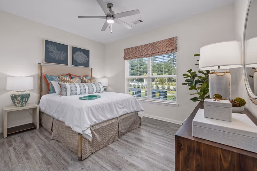 Bedroom featuring modern decor and ocean views at Coastal Exchange Apartments
