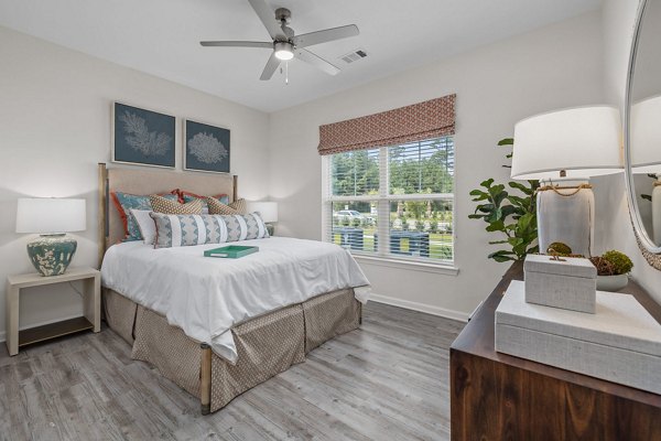 Bedroom featuring modern decor and ocean views at Coastal Exchange Apartments