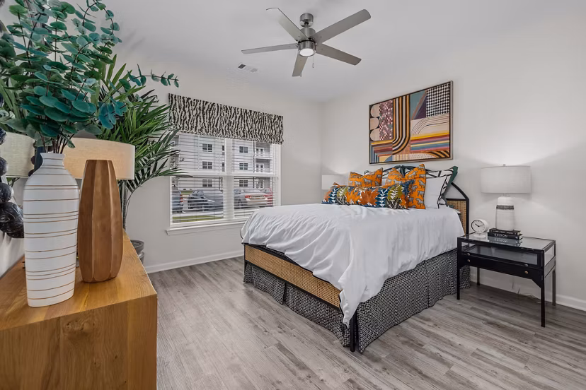 Modern bedroom with plush bedding at Coastal Exchange Apartments offering luxury living by the seaside