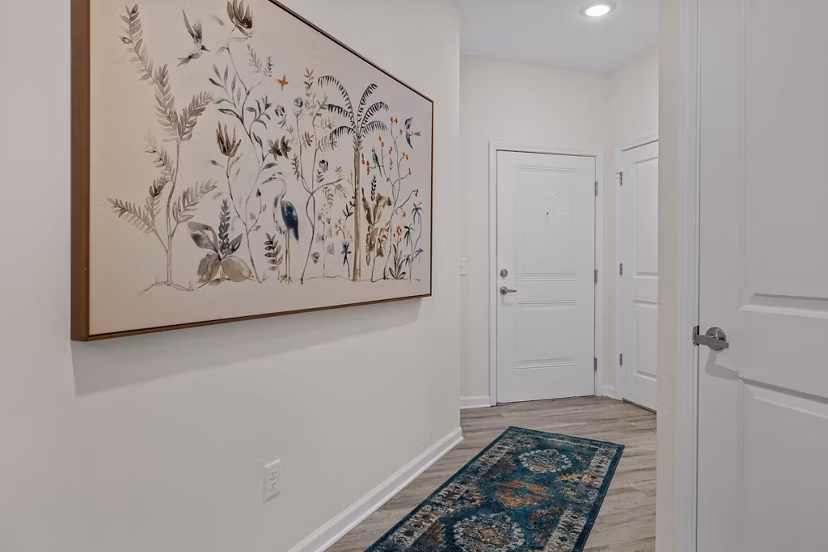 Elegant hallway with modern lighting at Coastal Exchange Apartments, offering a stylish and upscale living environment