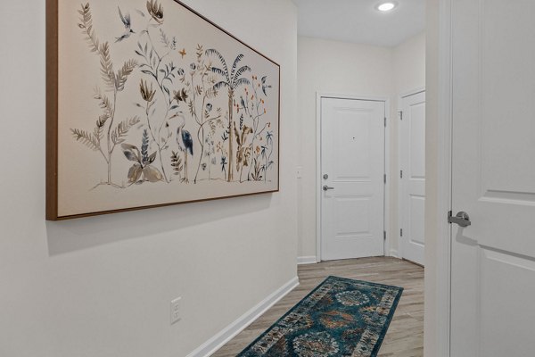 Elegant hallway with modern lighting at Coastal Exchange Apartments, offering a stylish and upscale living environment