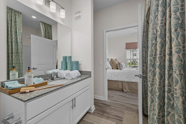 Modern bathroom with sleek fixtures at Coastal Exchange Apartments offering luxury amenities and contemporary design