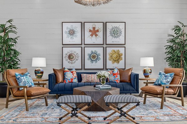 Clubhouse with modern seating and pool table at Coastal Exchange Apartments