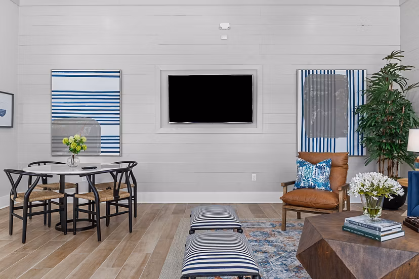 Clubhouse at Coastal Exchange Apartments with modern furnishings and social spaces, perfect for luxury living near the beach