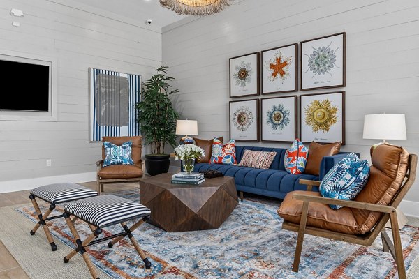 Coastal Exchange Apartments: Stylish clubhouse featuring modern decor and ample seating