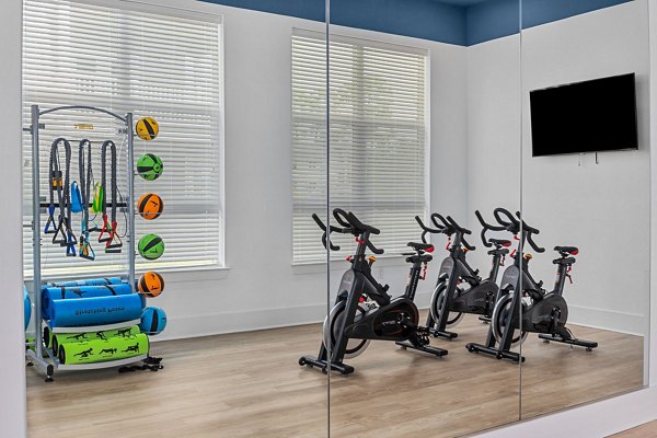 Modern fitness center with state-of-the-art equipment at Coastal Exchange Apartments
