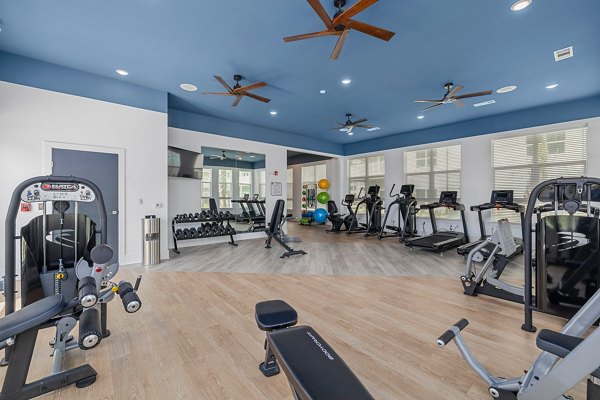 Fitness center with modern equipment at Coastal Exchange Apartments