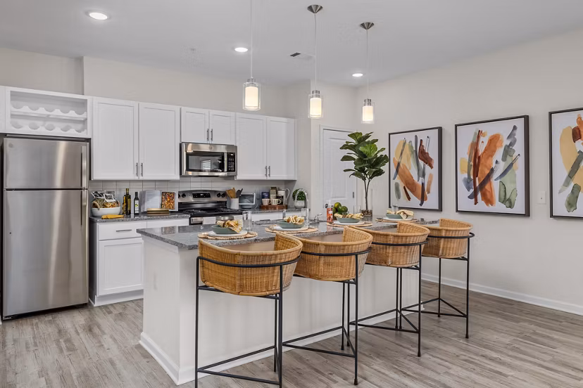 Modern kitchen featuring stainless steel appliances at Coastal Exchange Apartments