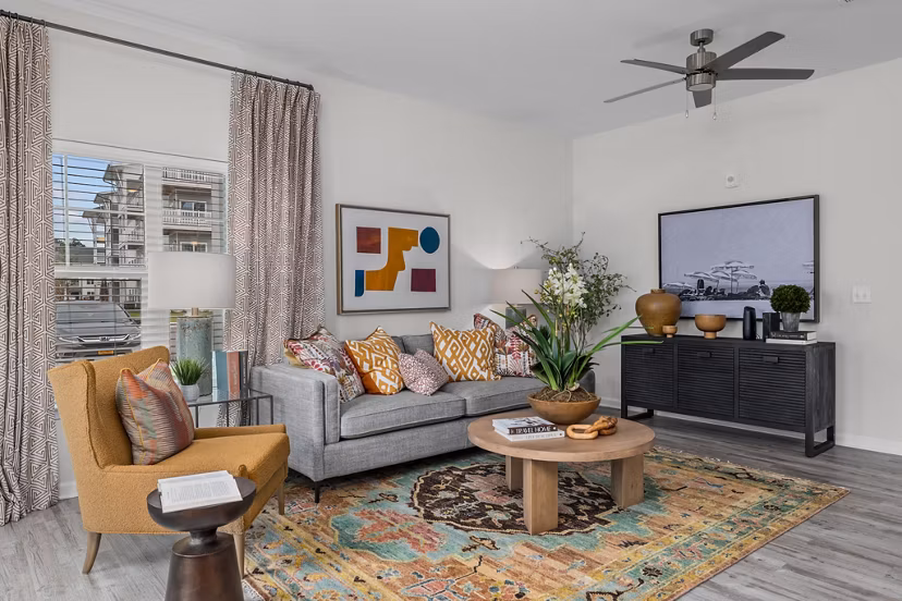 Modern living room with ocean-inspired decor at Coastal Exchange Apartments
