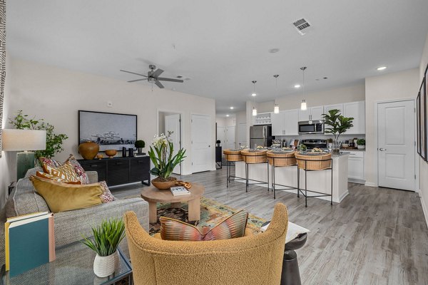 Modern living room with coastal decor at Coastal Exchange Apartments