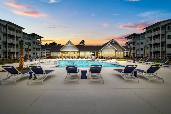 Infinity pool overlooking the ocean at Coastal Exchange Apartments, luxury living with scenic views and modern amenities