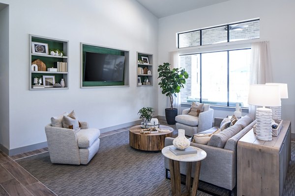 Clubhouse lounge featuring modern seating and elegant lighting at Prose Vista West Apartments