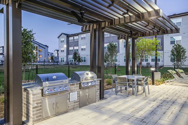 Inviting patio at Prose Vista West Apartments with lush greenery and modern seating for relaxation and entertaining