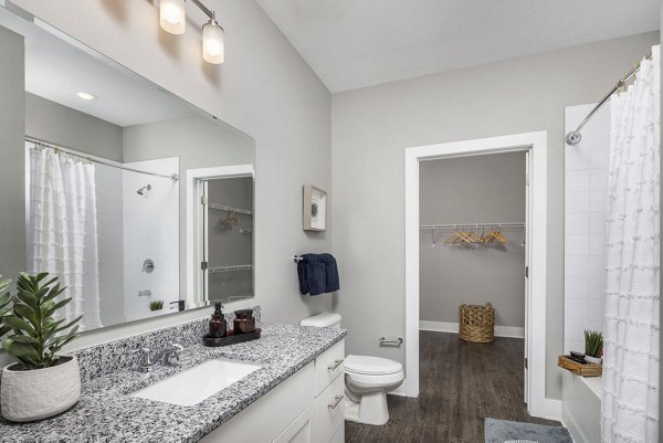 Modern bathroom with sleek fixtures at Prose Rhyne Apartments