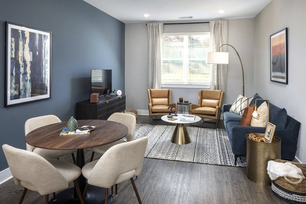 Modern dining area with sleek furnishings at Prose Rhyne Apartments, ideal for social gatherings and everyday luxury living