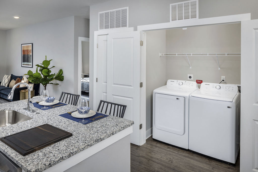 Laundry room at Prose Rhyne Apartments