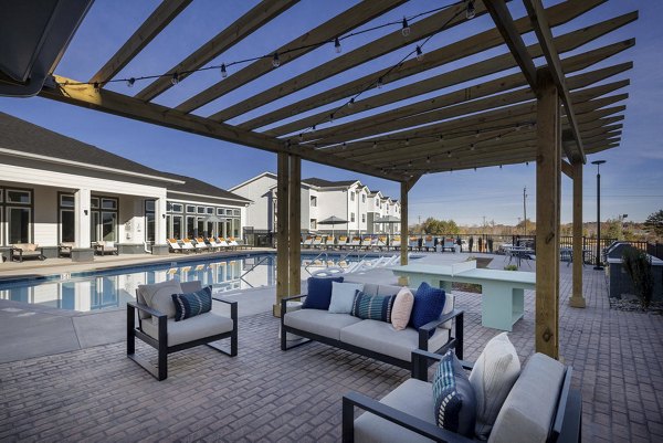 Relaxing courtyard with landscaped gardens at Prose Rhyne Apartments, offering a serene outdoor space for residents