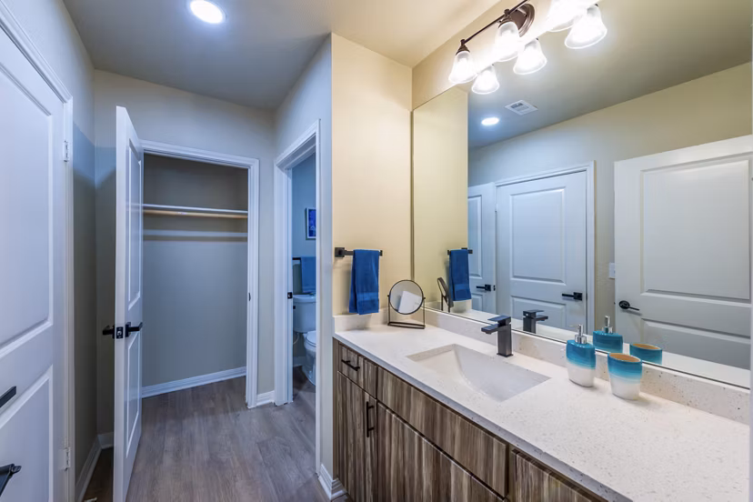 Modern bathroom featuring marble countertops at 4001 Midtown Apartments