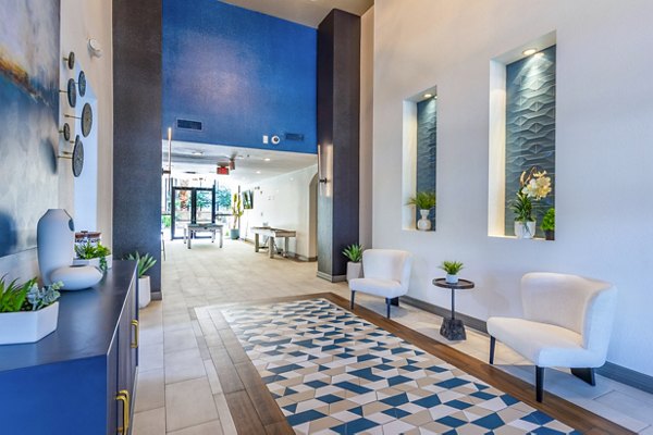 Clubhouse featuring modern furnishings and entertainment spaces at 4001 Midtown Apartments