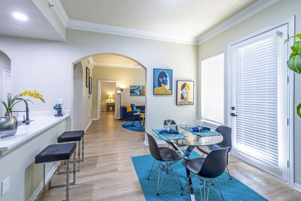 Elegant dining room with contemporary furnishings at 4001 Midtown Apartments, perfect for hosting dinners in style