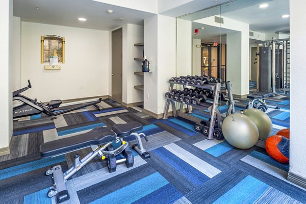 State-of-the-art fitness center at 4001 Midtown Apartments with modern equipment and spacious workout areas