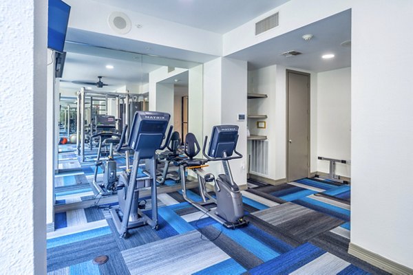 State-of-the-art fitness center with modern equipment at 4001 Midtown Apartments, ideal for an active urban lifestyle