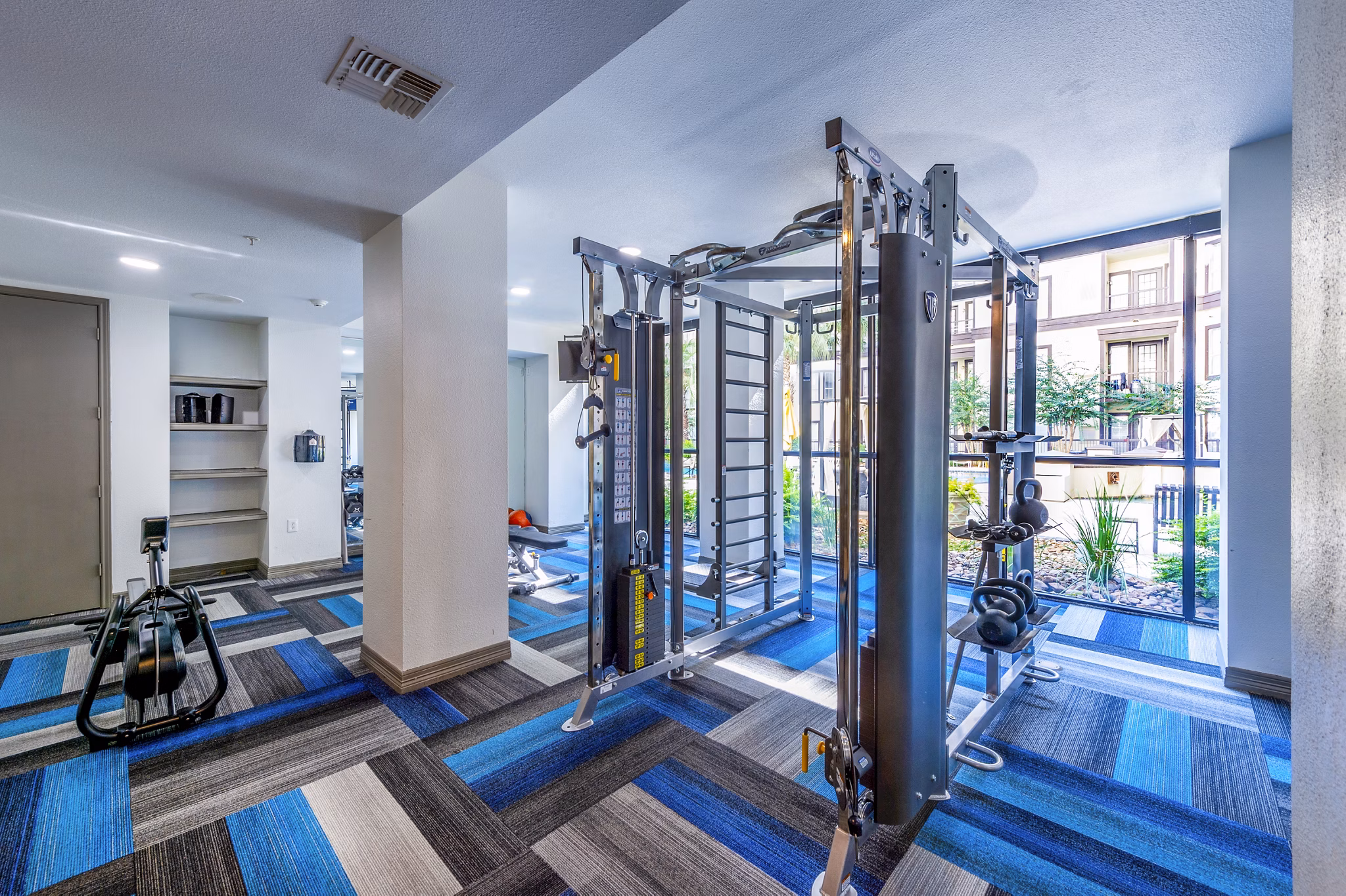 Well-equipped fitness center at 4001 Midtown Apartments featuring modern exercise machines and spacious workout areas