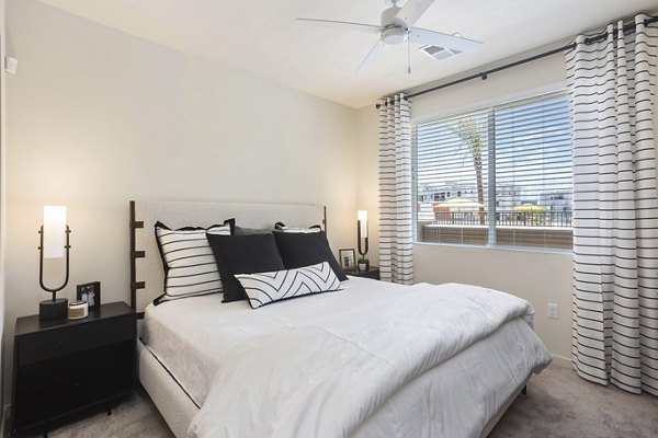 Cozy bedroom with modern decor at Prose Desert River Apartments