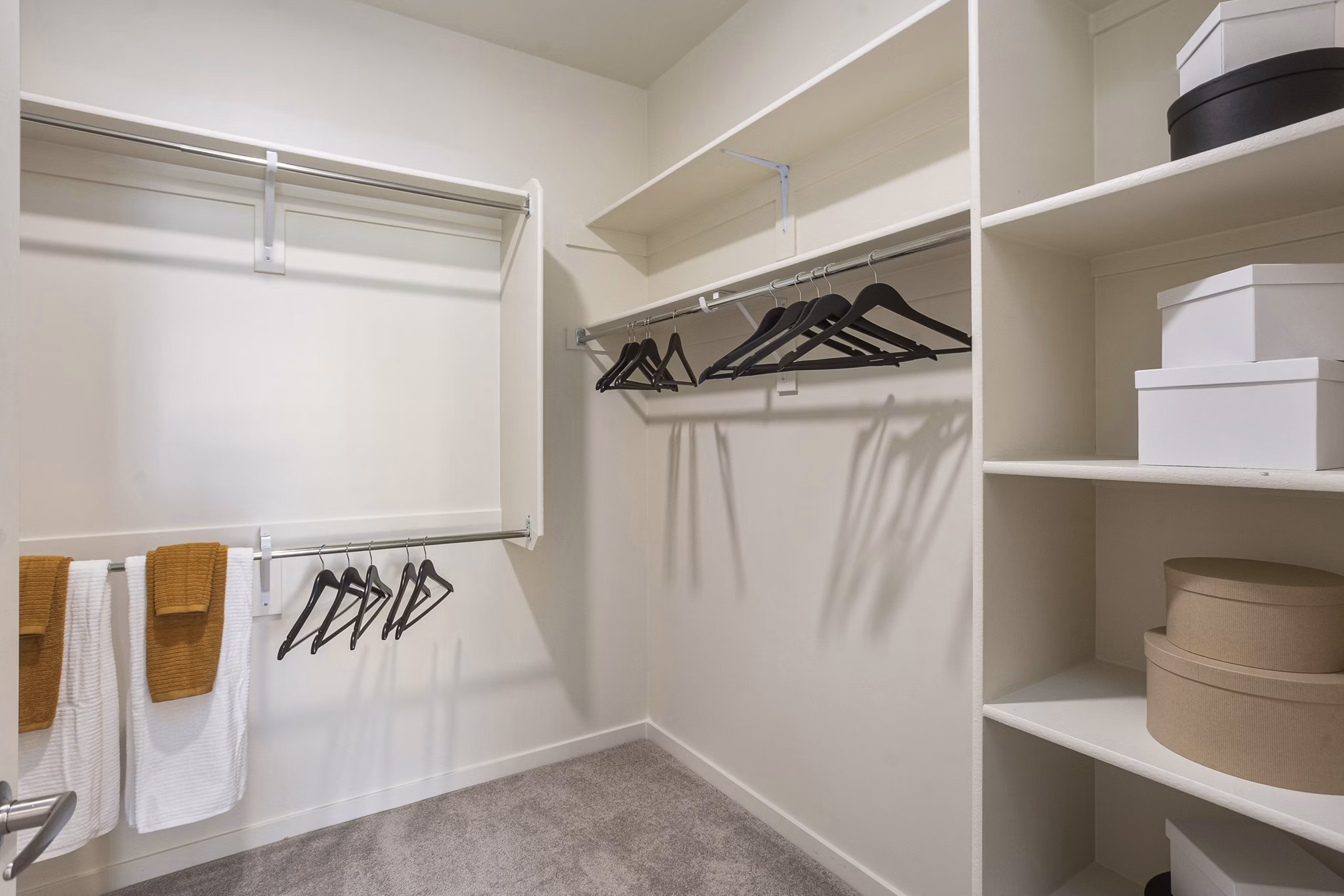 Walk-in closet with ample shelving at Prose Desert River Apartments, luxury rental by Greystar
