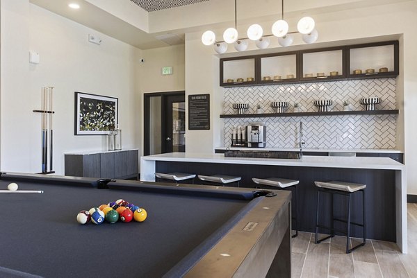 Elegant clubhouse with modern design at DASH Downers Grove Apartments, offering luxury amenities in a welcoming community setting