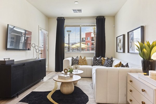 Elegant living room with plush seating and natural light at Prose Desert River Apartments in Arizona