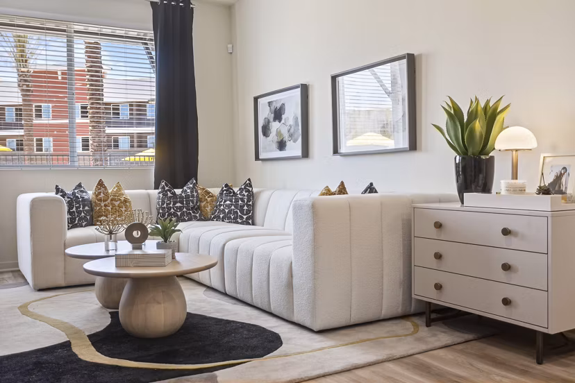 Spacious living room with modern decor at Prose Desert River Apartments