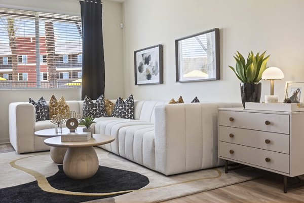 Spacious living room with modern decor at Prose Desert River Apartments