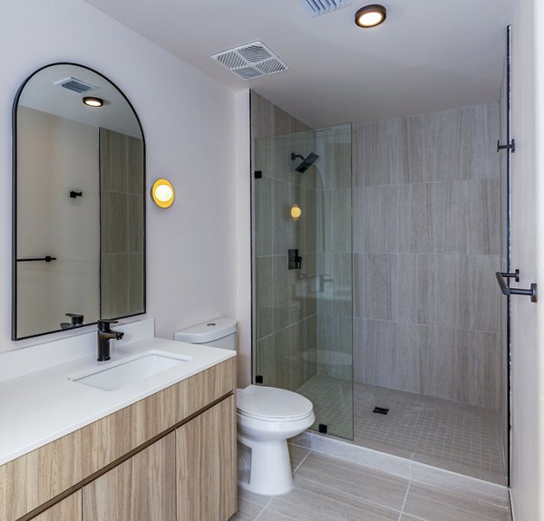 Bathroom with sleek modern fixtures at Metro Edgewater Apartments, luxury living by the waterfront