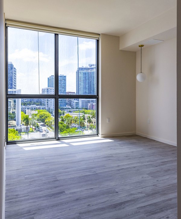 Spacious living room with contemporary furnishings at Metro Edgewater Apartments