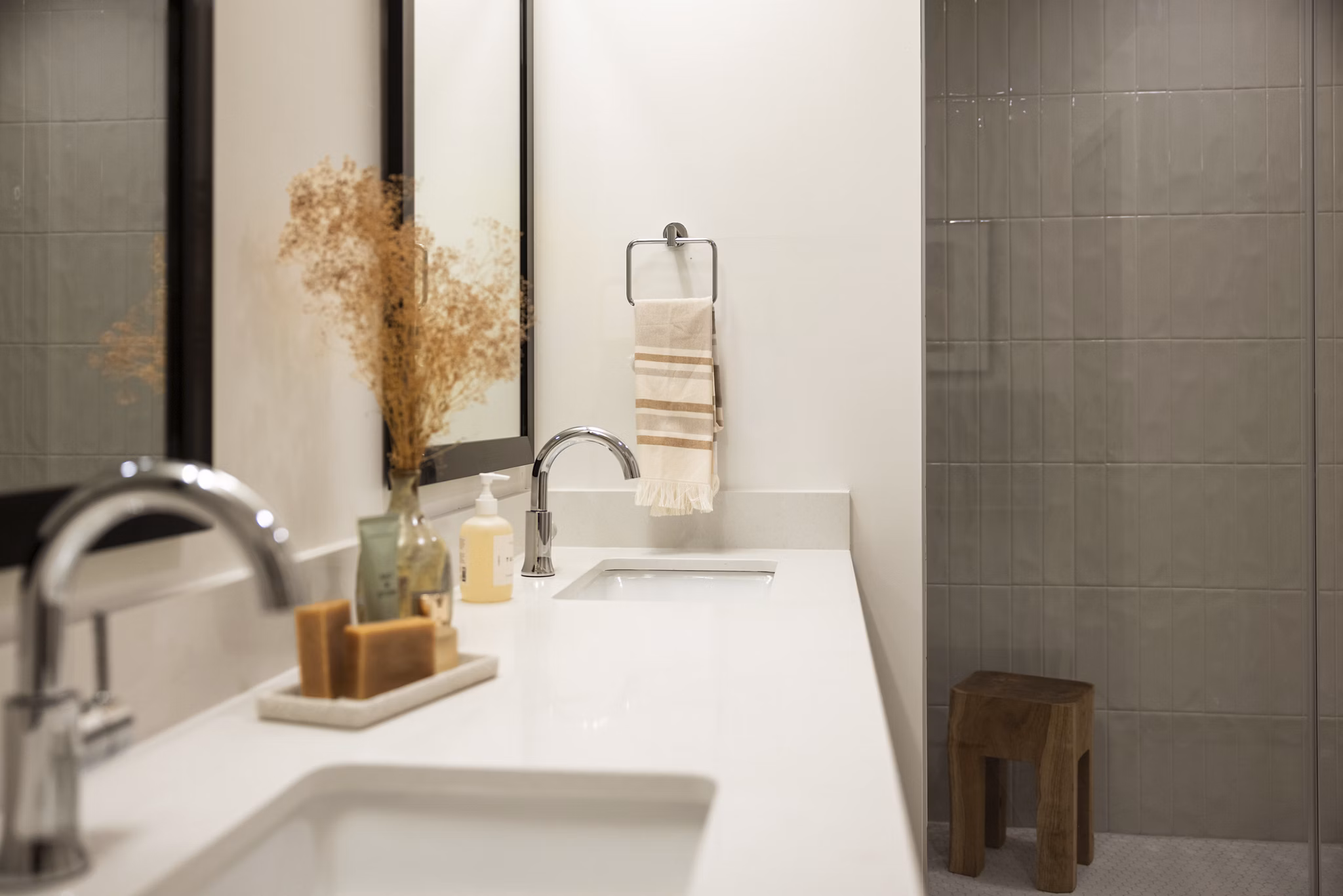 Modern bathroom design with marble countertops at The Waller Apartments