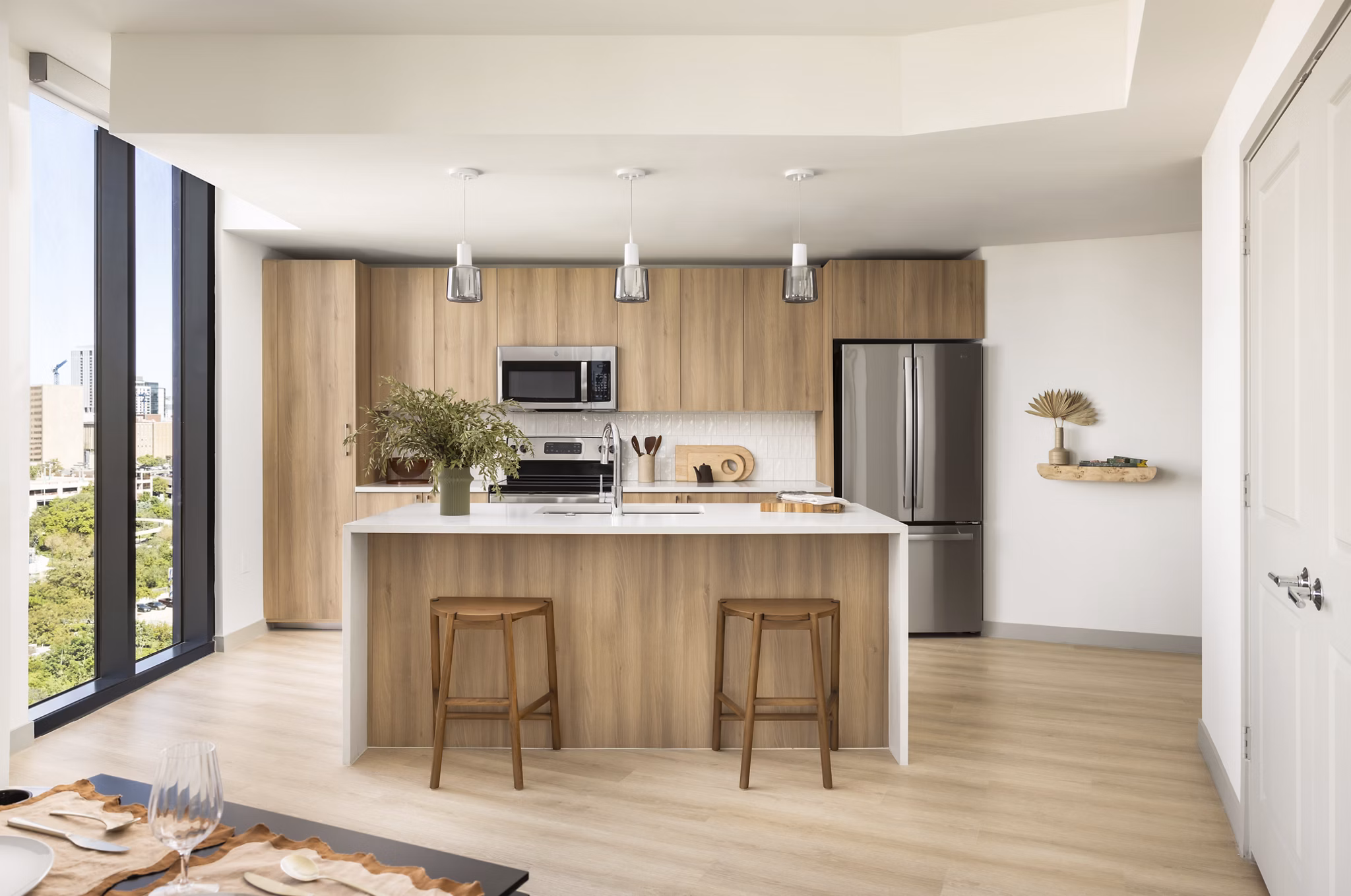 Modern kitchen with stainless steel appliances at The Waller Apartments, Greystar luxury infill community in vibrant urban location
